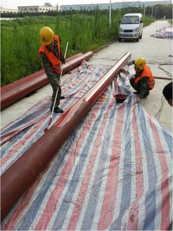 Pipe descaling and painting, welded openings