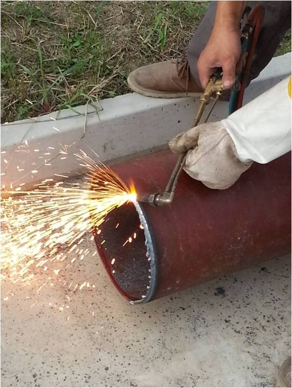 Pipe descaling and painting, welded openings