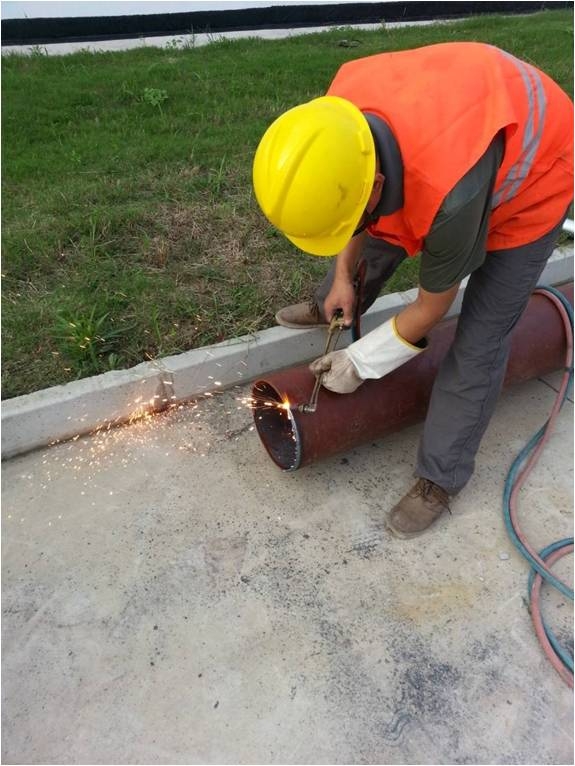 Pipe descaling and painting, welded openings
